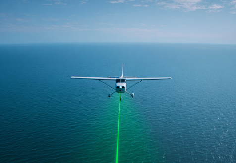 plane over water with laser beam pointed downward for bathymetry application